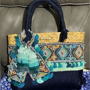 New, large custom made straw handbag, with tassel details.